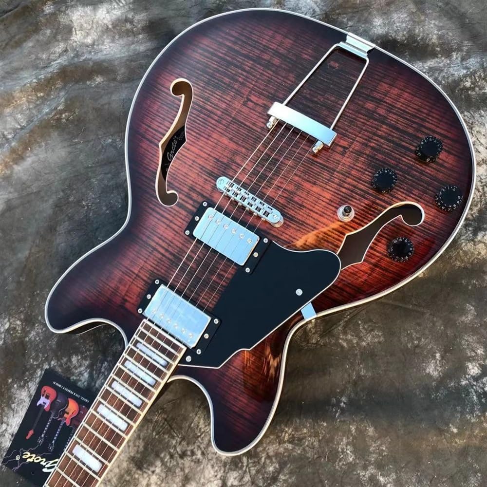 Left handed hollow body jazz guitar displayed in a home music room