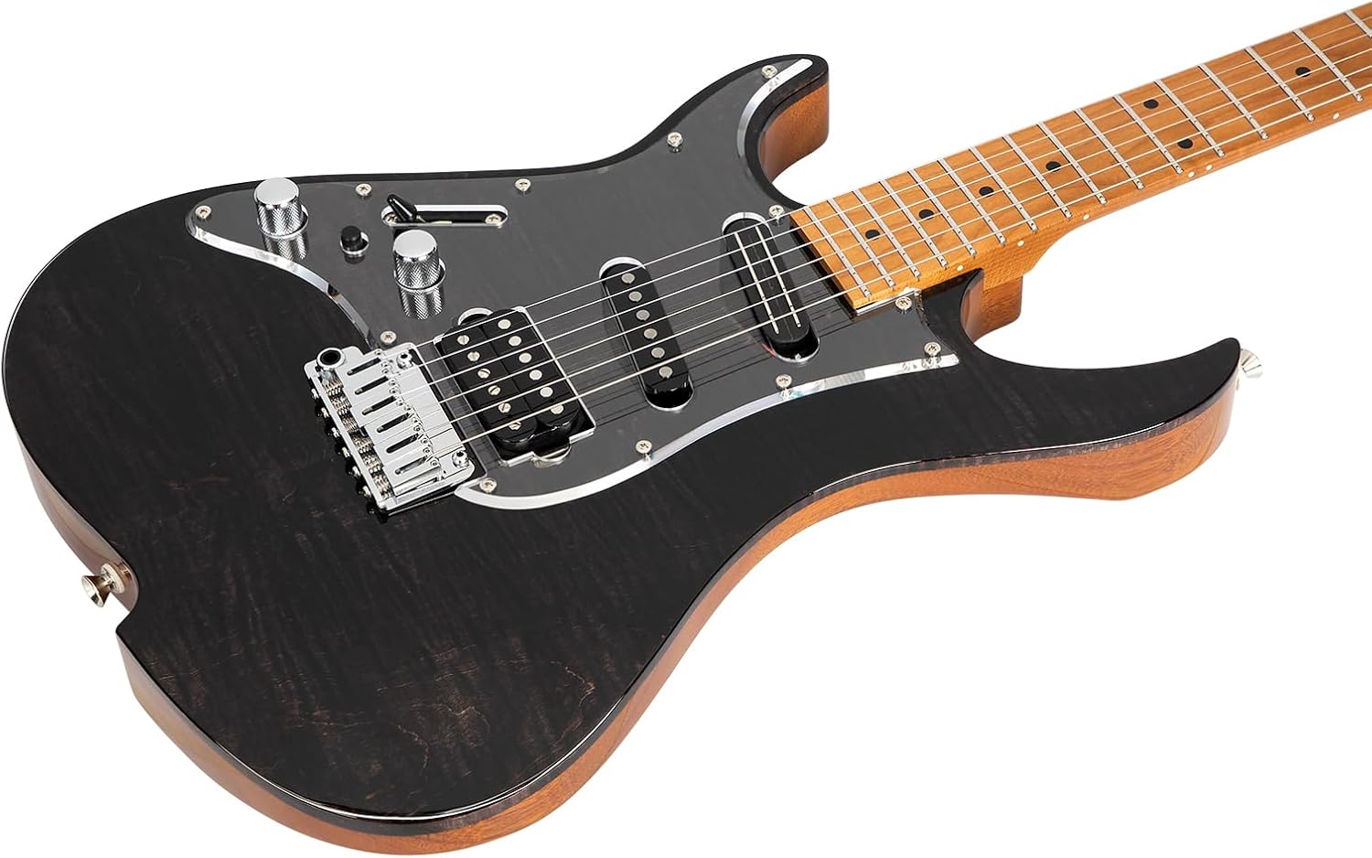 Left-handed electric guitar resting beside a home studio setup